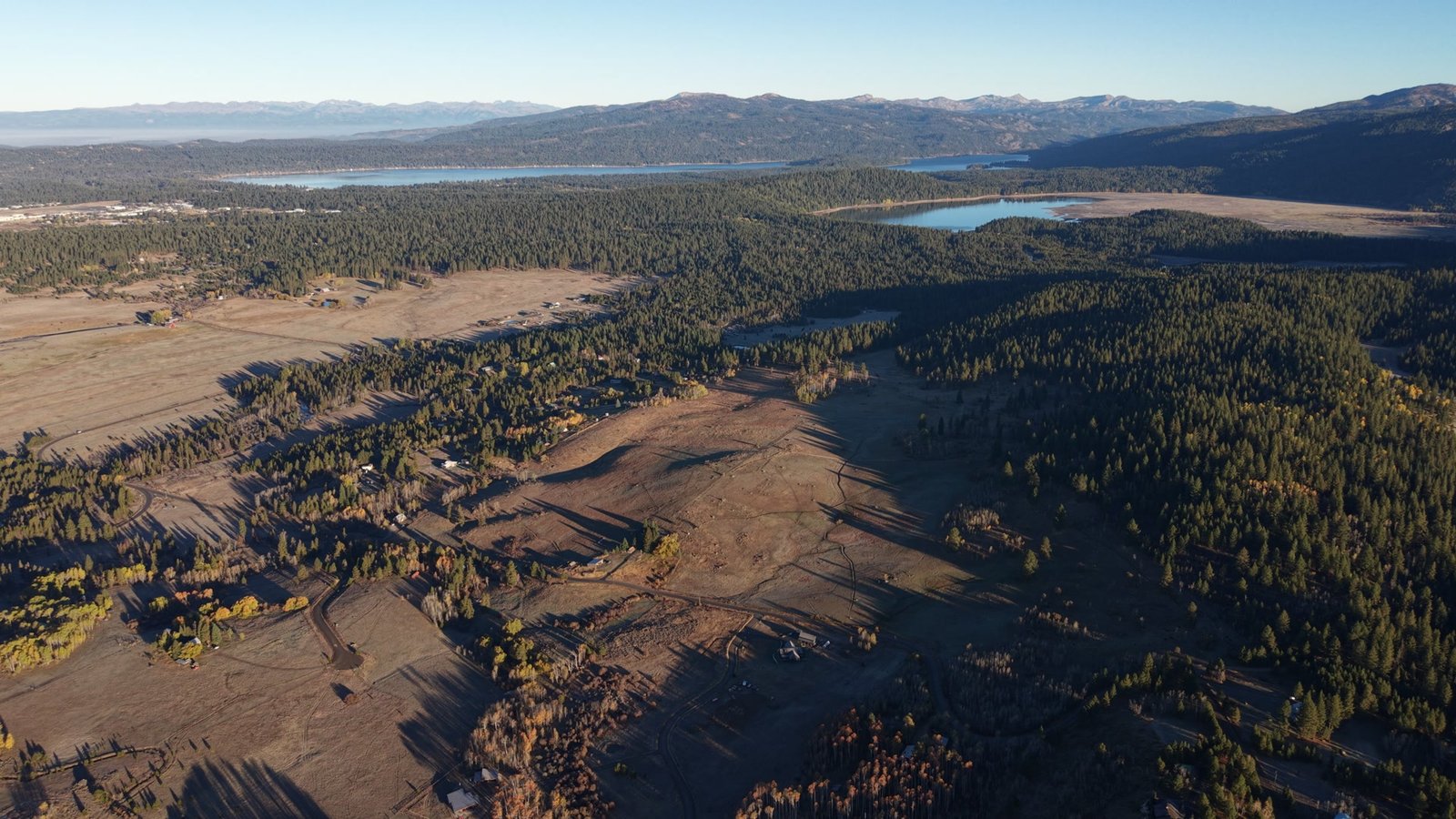 The Shaw Ranch valley near McCall, Idaho: open meadow, ponds and timbered hills
